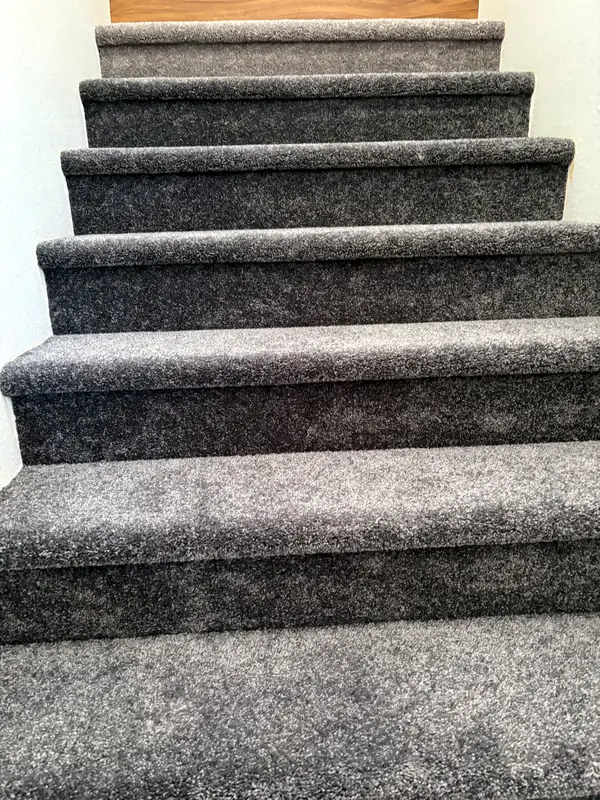 Charcoal plush carpet on stairs