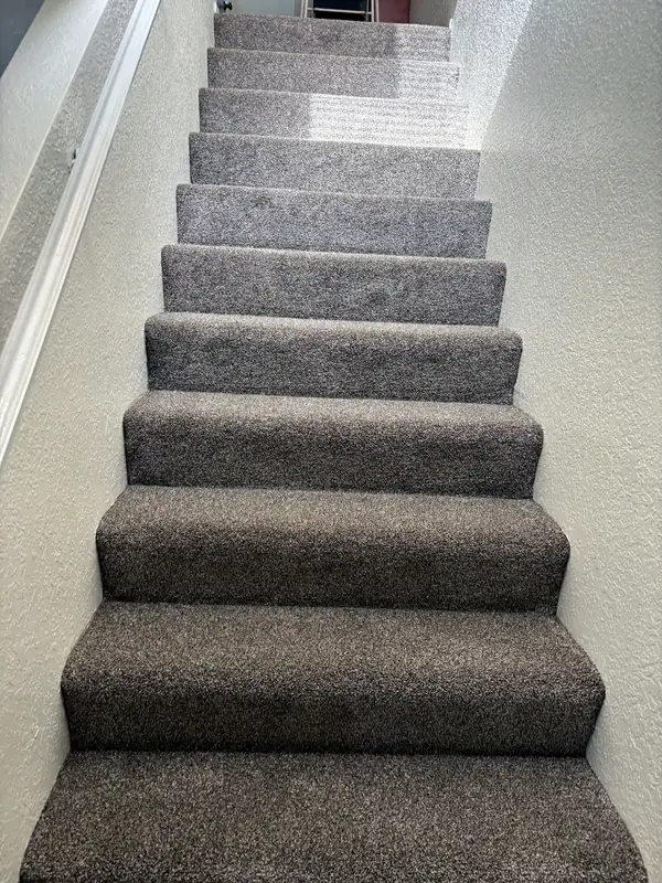 Silver-grey carpet on a long straight run — Dream Space Remodel flooring job