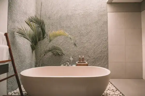 Bathroom with a freestanding tub and plants
