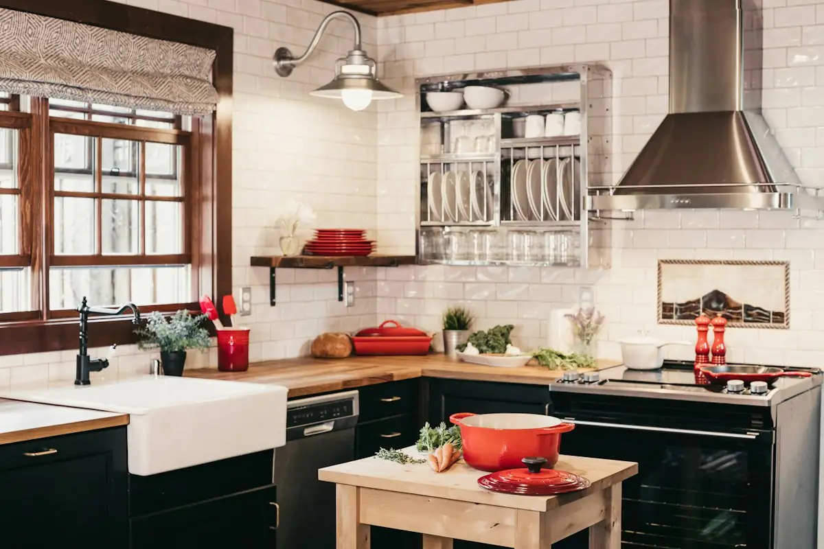 Bright small kitchen with white cabinets and modern fixtures in an Orange County home