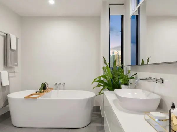 Bathroom with a freestanding tub and a double vanity